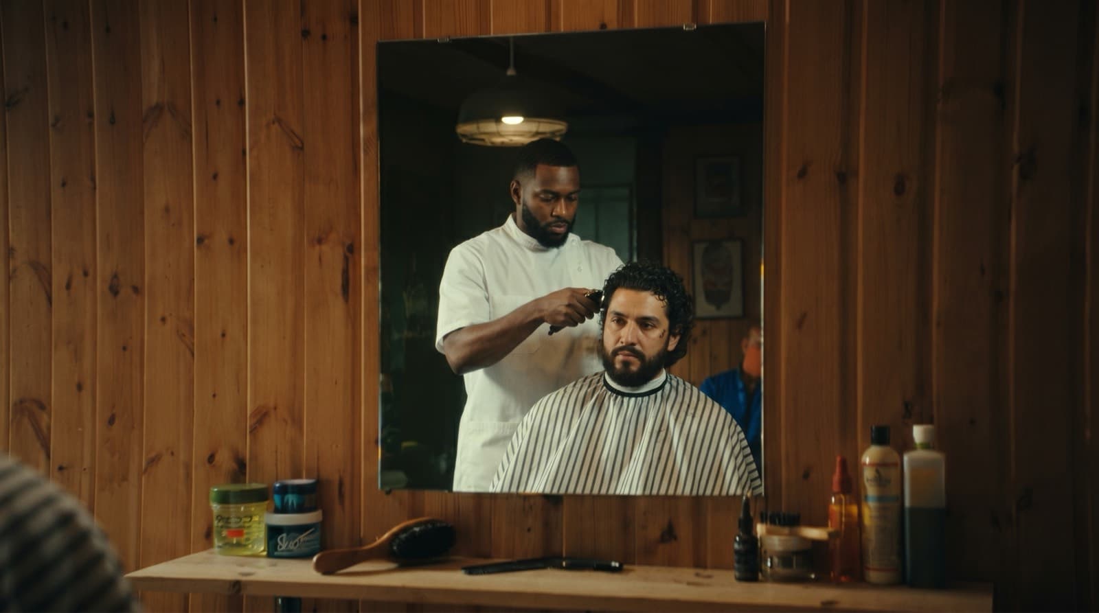 A barber focused on their craft
